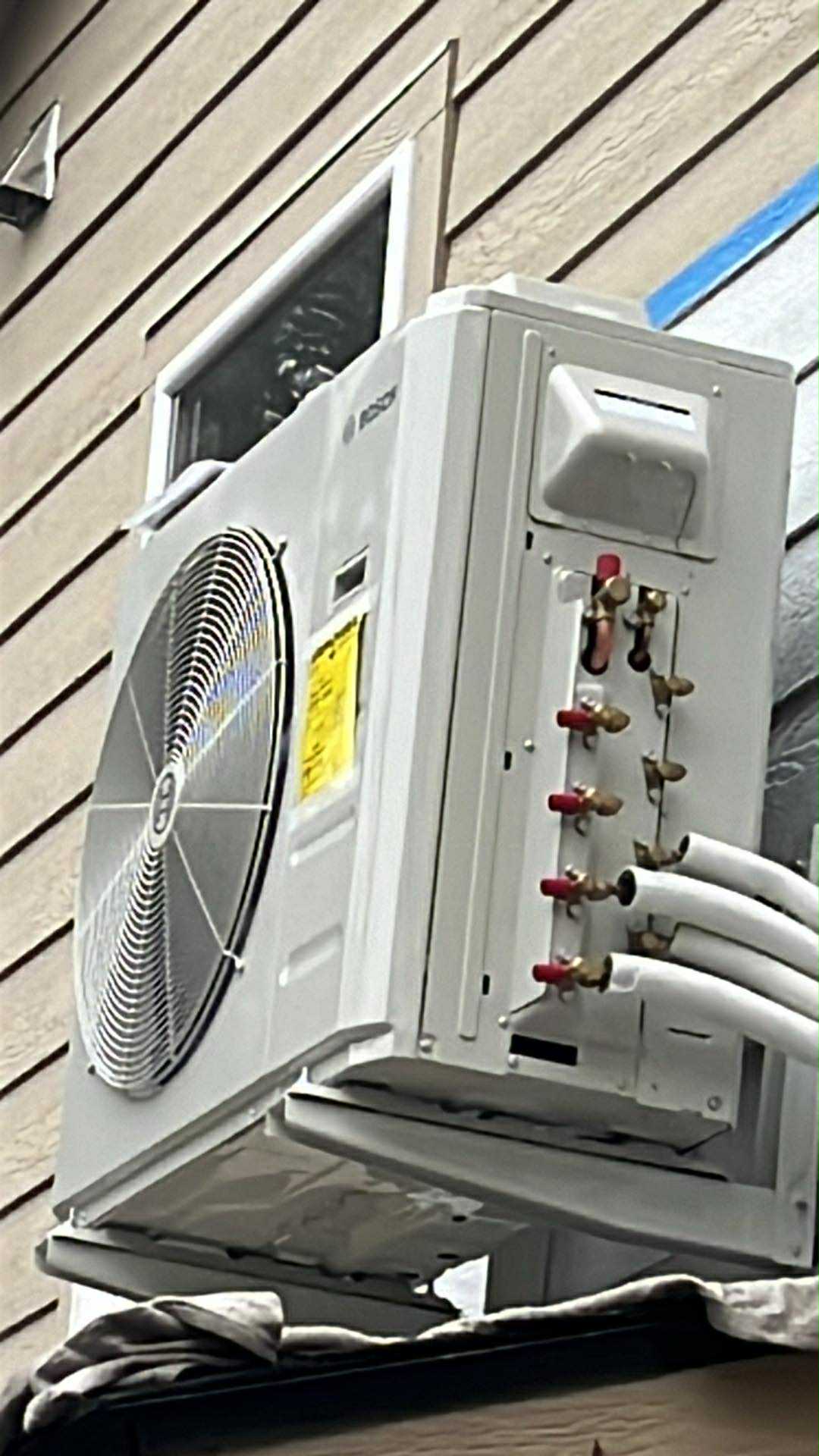Bosch mini-split outdoor condenser unit with refrigerant lines on exterior wall Yakima WA