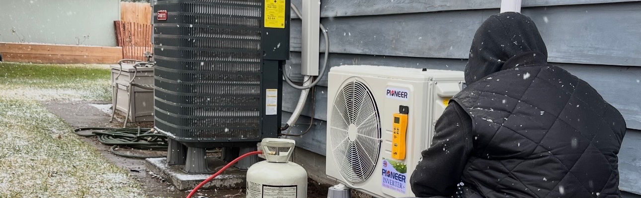 Manuel's Mechanical Services HVAC technician working on commercial unit
